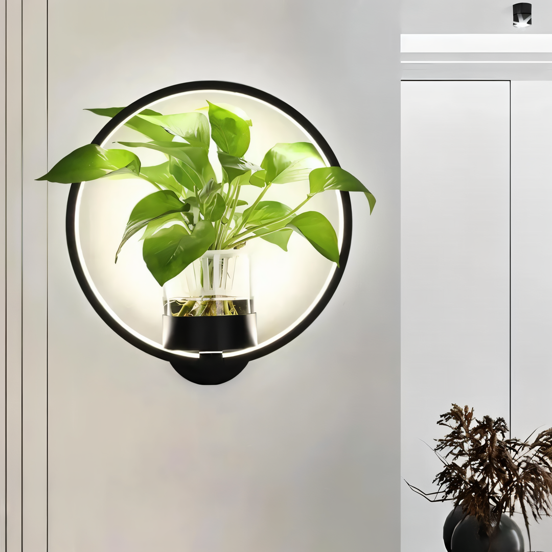 Applique murale LED moderne blanche avec support de plante intégré. Design minimaliste.
