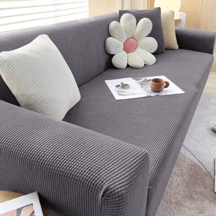 Textile maison: housse canapé lavable machine, élastique, pour un salon toujours impeccable.