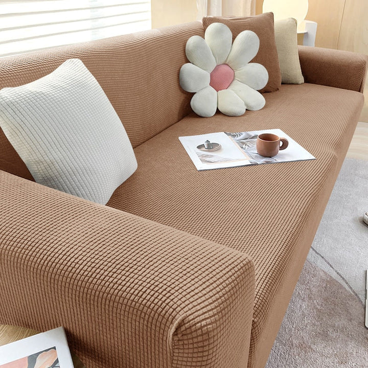 Housse canapé élastique anti-taches, pet friendly, pour protéger votre meuble avec élégance.