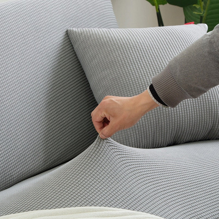 Housse de canapé élastique jacquard, protection durable et lavable pour votre meuble.