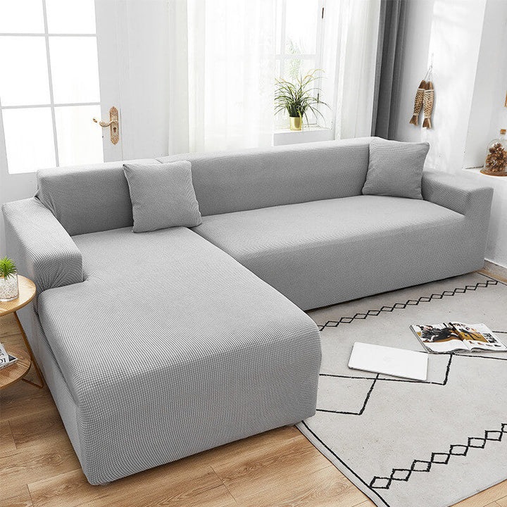 Protégez votre canapé avec cette housse anti-taches, pet friendly, style moderne.
