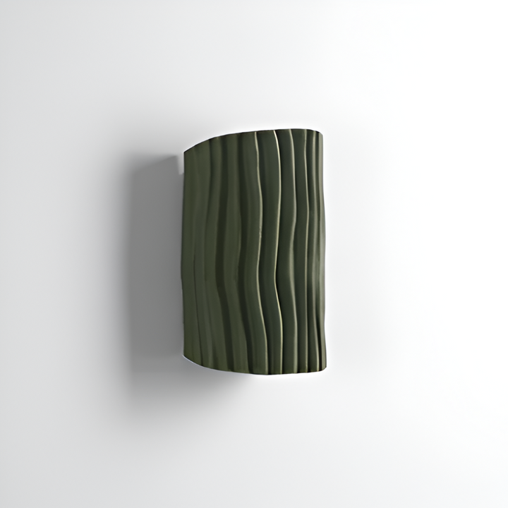 Design plissé Veloura et lumière LED: cette applique murale crée une ambiance chaleureuse unique.