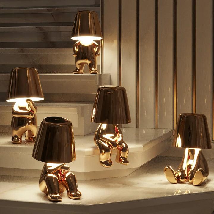 Décoration lumineuse LED dorée, lampe Le Penseur rechargeable pour une ambiance chic.