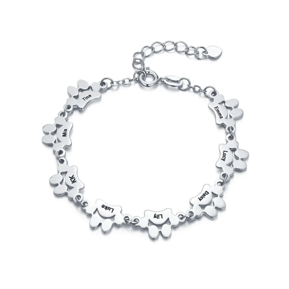 Bracelet PawEmbrace personnalisable, avec gravure patte unique. Bijou en acier inoxydable, parfait pour les passionnés d'animaux.