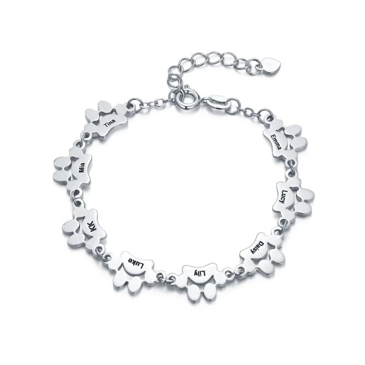 Bracelet PawEmbrace personnalisable, avec gravure patte unique. Bijou en acier inoxydable, parfait pour les passionnés d'animaux.