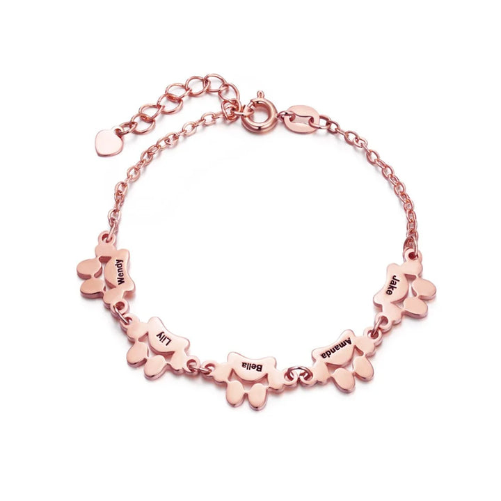 Accessoire femme : bracelet personnalisé PawEmbrace, gravure de patte. Acier inoxydable pour un souvenir durable d'animal.