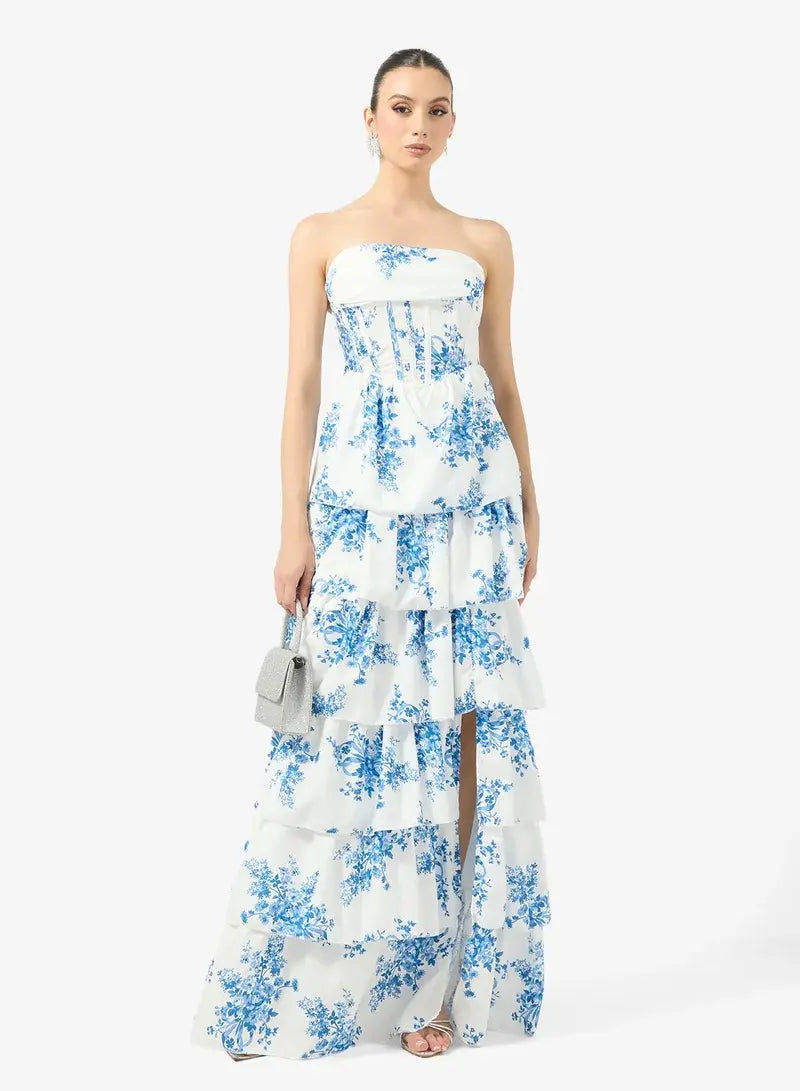 Robe longue femme bleue à imprimé floral, coupe élégante, fente latérale, parfaite pour soirée ou cérémonie.