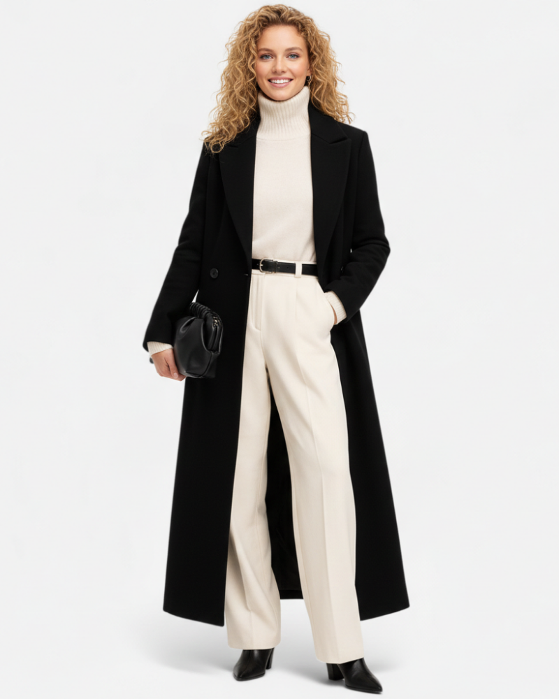 Manteau long noir élégant pour femme avec col revers chic, idéal automne/hiver. Style sophistiqué et professionnel.