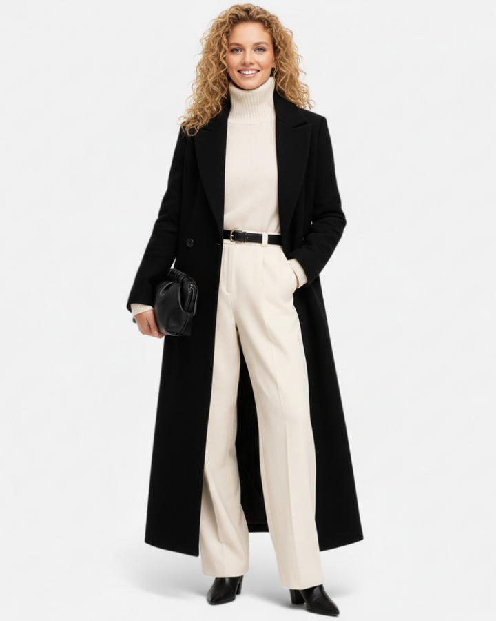 Manteau long noir élégant pour femme avec col revers chic, idéal automne/hiver. Style sophistiqué et professionnel.