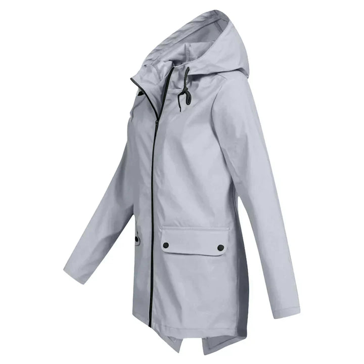 Manteau de pluie long femme pour temps humide, protection élégante contre les intempéries, coupe-vent.