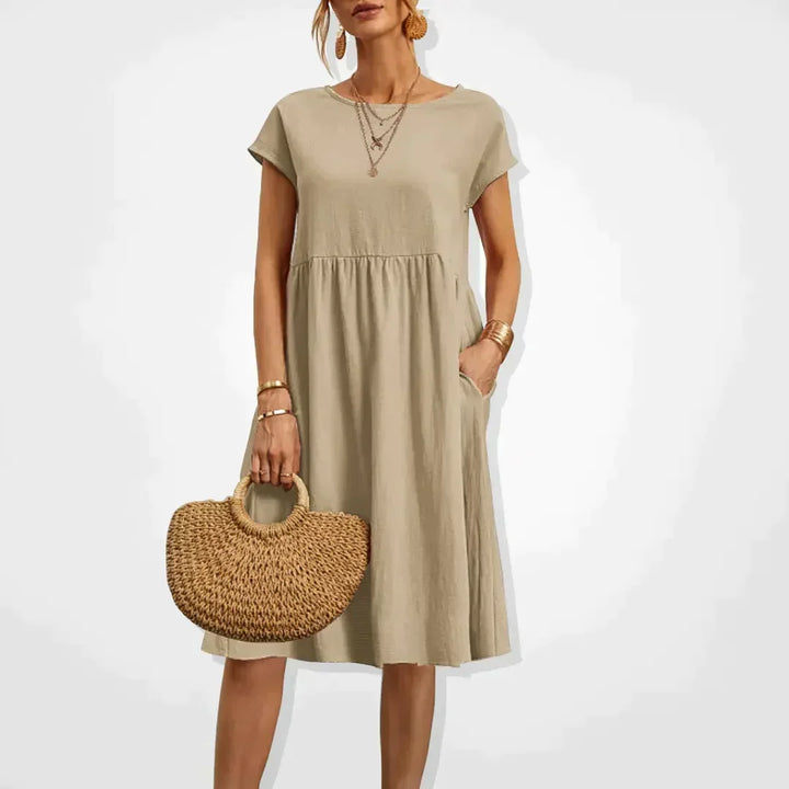 Robe d'été femme empire légère et chic avec poches, idéale pour le confort décontracté en vacances.