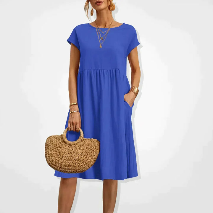 Robe d'été femme fluide et légère, coupe empire avec poches. Style chic et décontracté pour la plage.