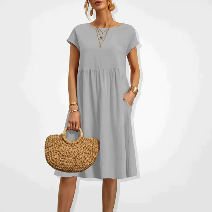 Robe d'été femme chic et légère, style empire avec poches discrètes. Parfaite pour le quotidien ou la plage.