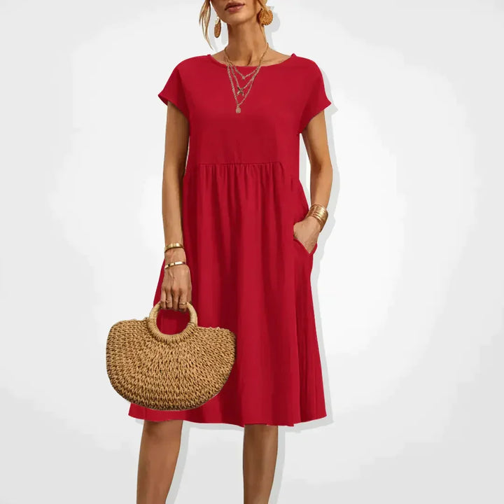 Robe empire femme élégante et légère. Idéale pour les vacances d'été, avec ses poches pratiques.