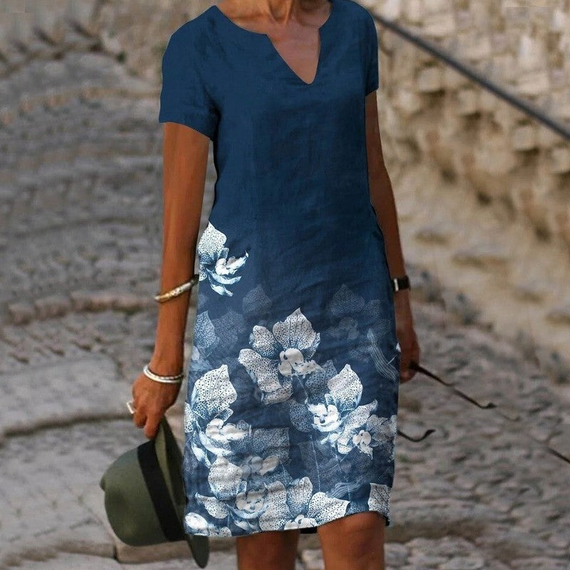 Robe midi femme à imprimé floral coloré, style bohème chic, parfaite pour une allure décontractée printanière.