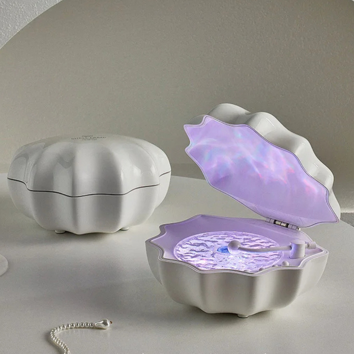 Haut-parleur Bluetooth Lumière Vagues; offre une ambiance marine immersive pour la détente et l'écoute.