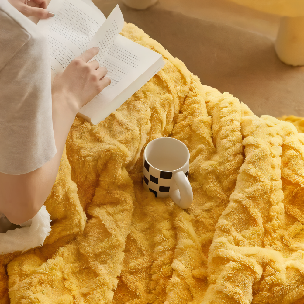 Jeté polaire réversible et chaleureux, idéal pour les soirées cocooning sur le canapé ou au lit.