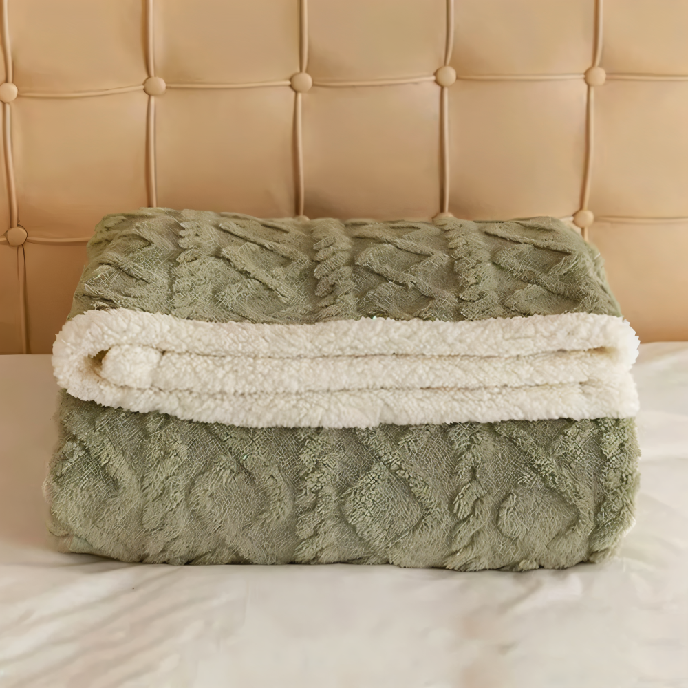 Plaid réversible et chaud, en laine polaire ultra-douce, pour des moments cosy sur le canapé.