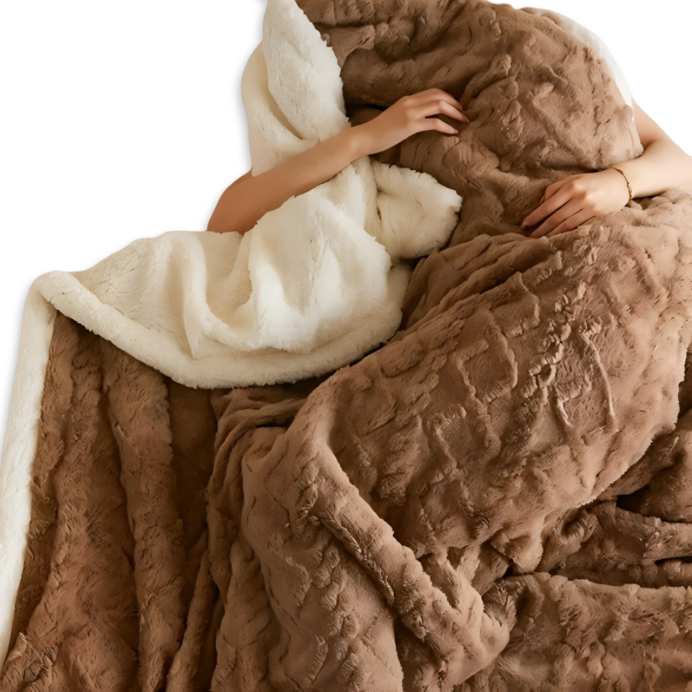 Plaid réversible et chic en fausse laine polaire, parfait pour une ambiance chaleureuse et élégante.