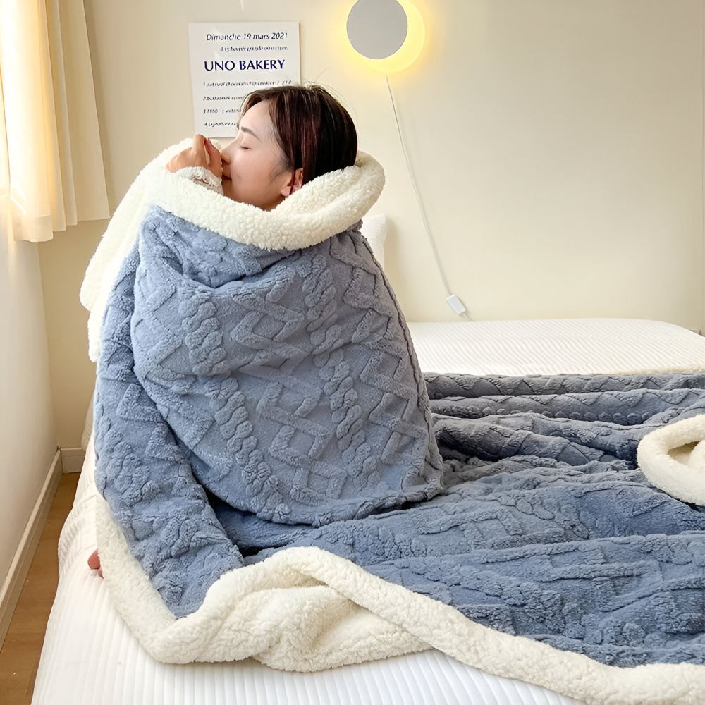 Couverture polaire ultra douce, réversible, parfaite pour un confort douillet à la maison.
