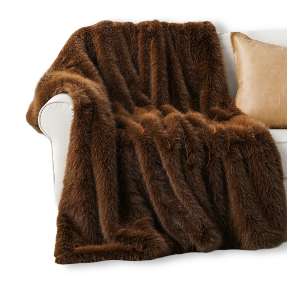 Fausse fourrure douce et chaude pour ce plaid élégant, idéal comme couverture de lit ou de canapé.
