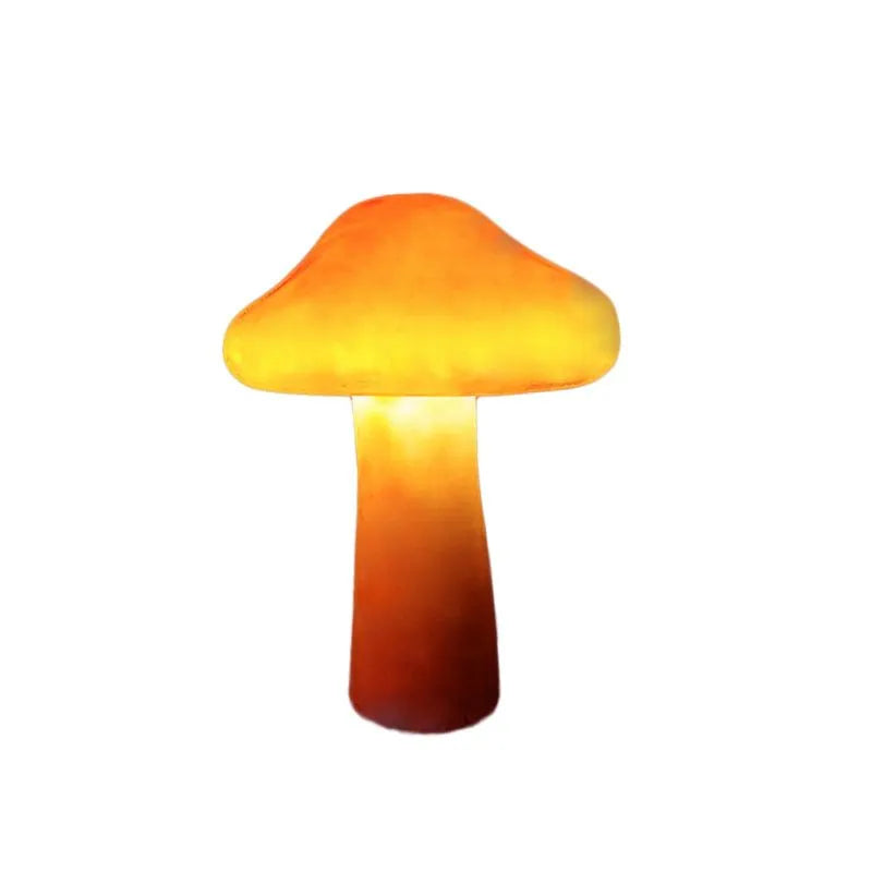 Lampes de jardin LED champignon orange illuminées la nuit, créant une ambiance magique en résine pour l'extérieur.