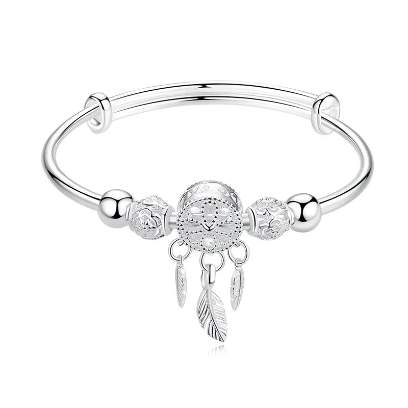 Cadeau idéal: bracelet attrape-rêves rond en argent 925 pour femme, élégant et significatif.