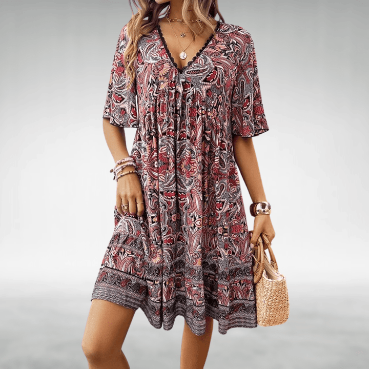 Robe trapèze bohème femme avec imprimé floral coloré, silhouette fluide et confortable mode estivale.