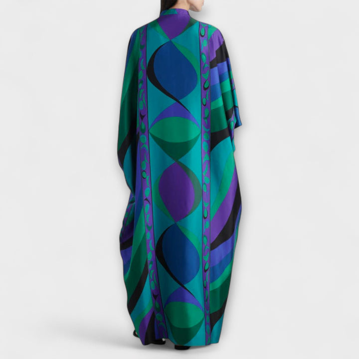 Magnifique kaftan psychédélique en satin pour femme, couleurs vibrantes et coupe fluide. Idéal plage et été.