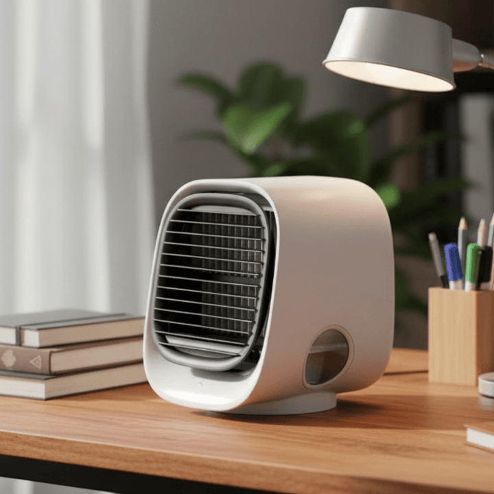 Mini climatiseur humidificateur USB portable 2-en-1 pour bureau et chambre, rafraîchissant et silencieux.