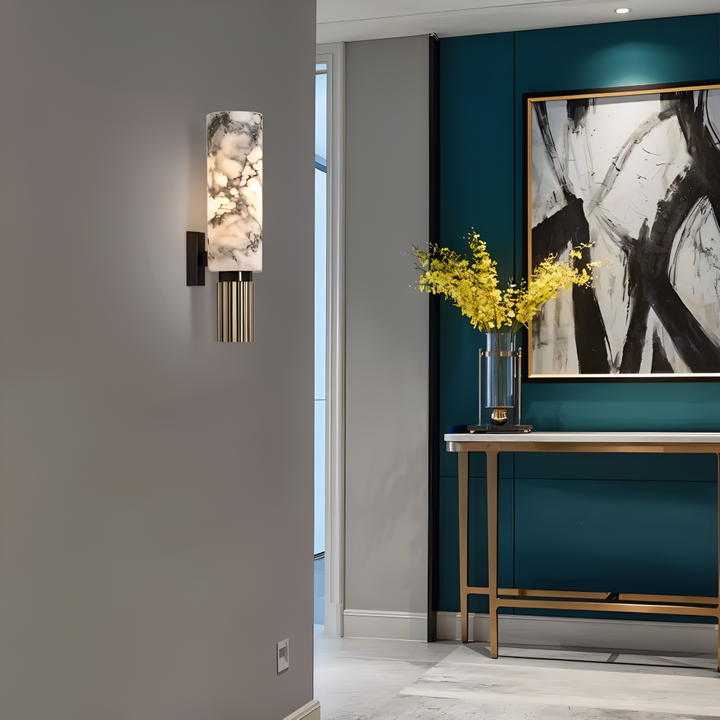 Applique marbre LED moderne, forme cylindrique, pour un éclairage mural intérieur chaleureux.
