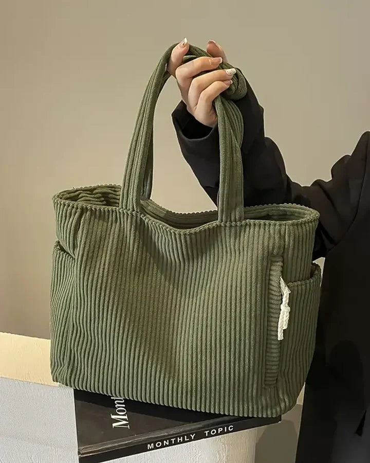 Sac cabas femme élégant, texture côtelée distinctive. Design moderne avec cordon pour un look sophistiqué.