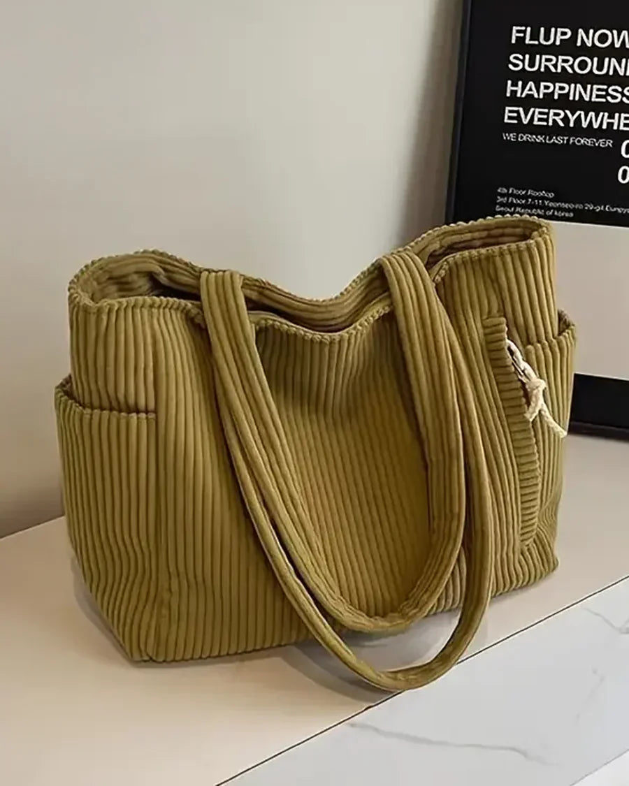 Sac fourre-tout femme élégant, design côtelé moderne avec cordon, idéal pour le rangement quotidien.