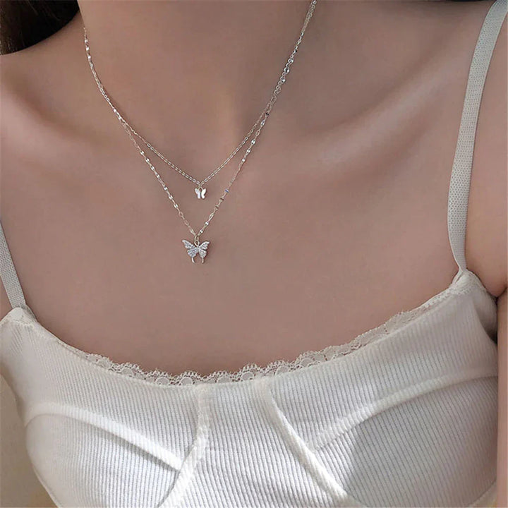Collier femme papillon zircon brillant. Double chaîne argent hypoallergénique, bijou élégant et parfait cadeau.