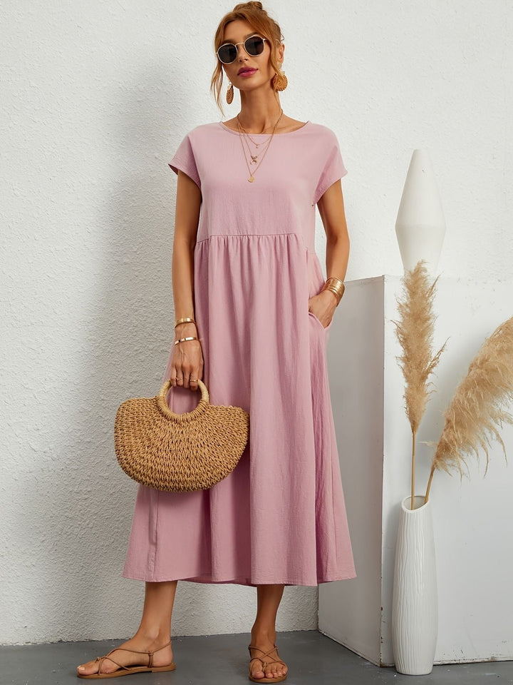 Robe Mathilda chic, féminine et confortable, parfaite pour la saison estivale.