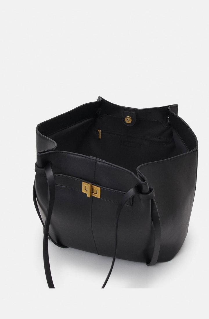 Sac fourre-tout marron, en cuir synthétique. Un accessoire de mode chic et polyvalent pour femme.
