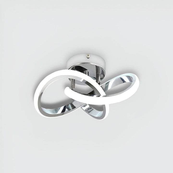 Luminaire LED abstrait et moderne, dimmable, parfait pour tout intérieur.