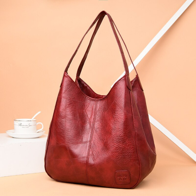 Sac épaule chic en cuir véritable, accessoire élégant pour femme moderne.