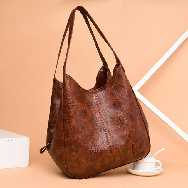 Sac à épaule femme en cuir véritable, idée cadeau chic et pratique.