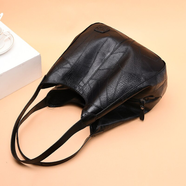 Sac en cuir véritable durable pour femme, élégance et résistance au quotidien.
