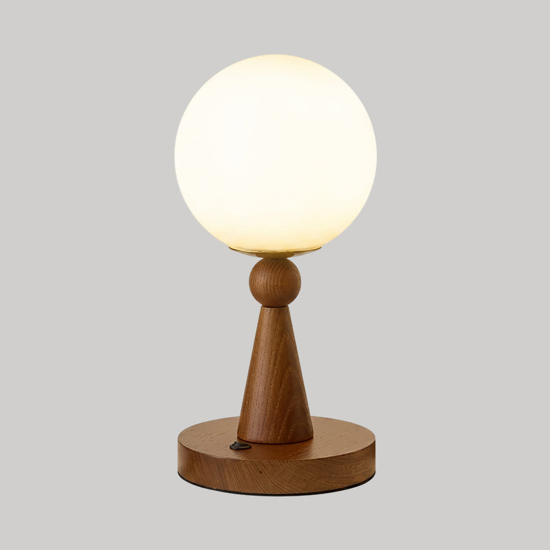 Éclairage d'appoint moderne: lampe de table sphérique pour salon ou chambre, avec son design élégant et contemporain.