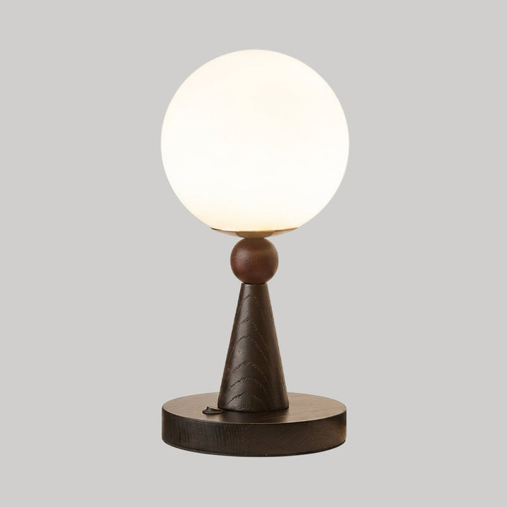 Lampe de table décorative avec abat-jour sphérique et base moderne, apportant une touche d'élégance à votre intérieur.