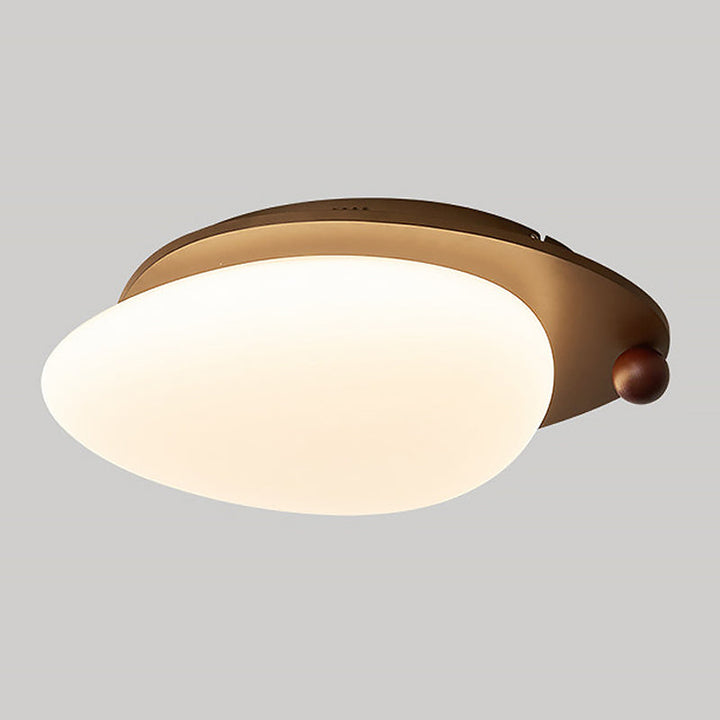 Luminaire plafond LED élégant en bois et métal, idéal pour éclairer discrètement un intérieur moderne.