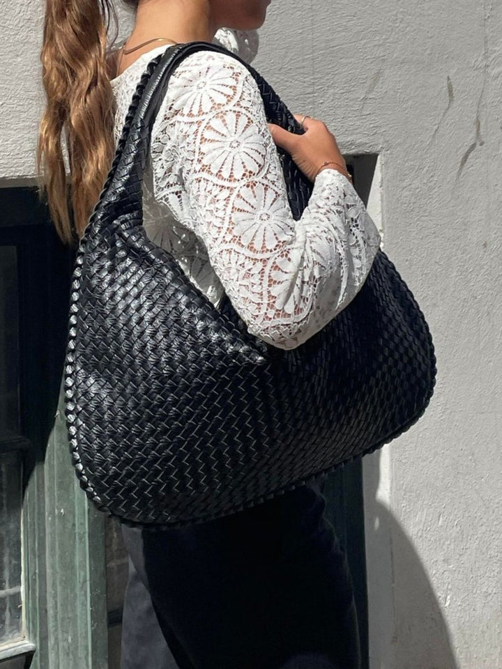 Sac à main TASKTOTE fermé et sécurisé, un compagnon chic et fiable pour l'organisation quotidienne des femmes.