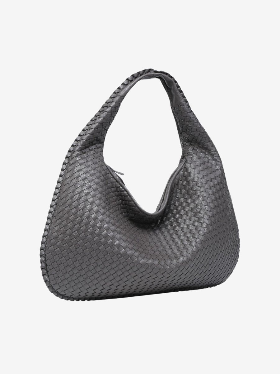 Anses solides du sac à main TASKTOTE, confortables pour porter ce grand sac cabas élégant et fonctionnel.