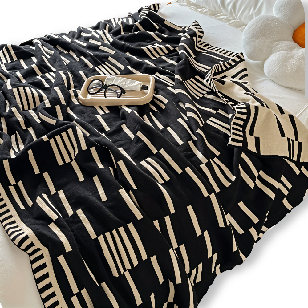 Couverture plaid douce tricotée noir et beige, en acrylique, parfaite pour canapé, lit et toutes saisons.