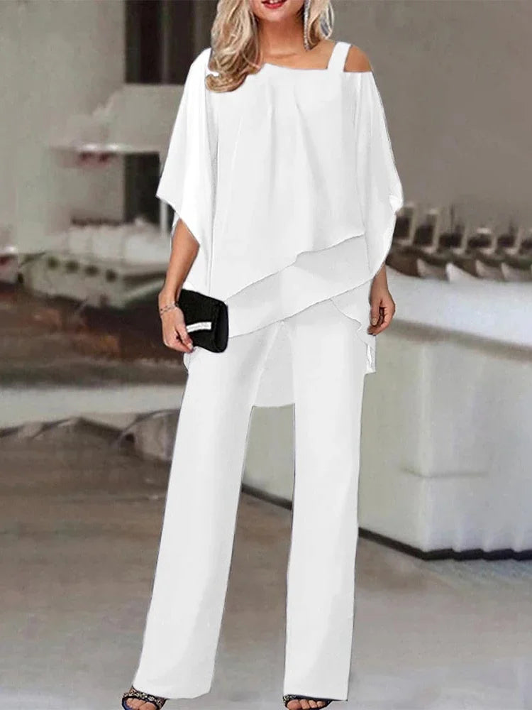 Femme portant un ensemble élégant, pantalon et haut coordonnés. Tenue chic et confortable, parfaite pour la mode été.