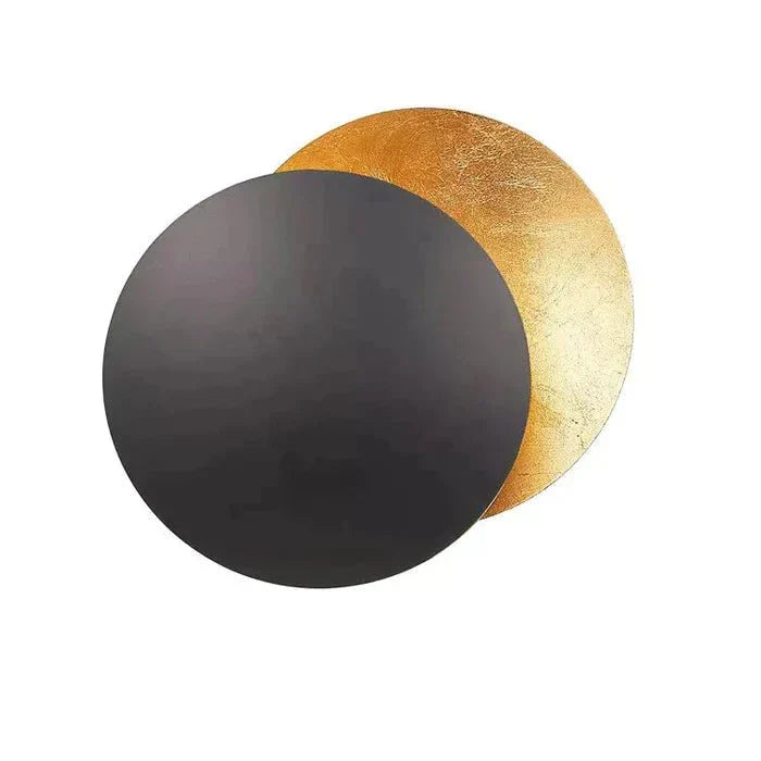 Éclairage mural LED design moderne, motif eclipse, en or ou cuivre pour une ambiance cosy et lumineuse.