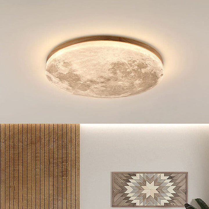 Plafonnier lune 3D LED moderne, idéal pour chambre ou salon, diffuse une lumière douce.