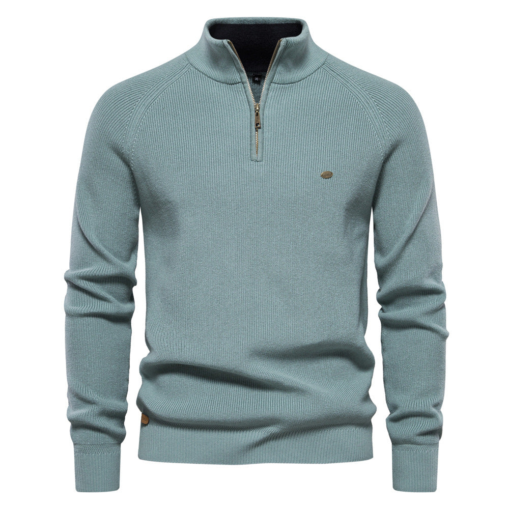 Pull homme demi-zippé noir, coupe moderne. Vêtement élégant et confortable pour l'automne. Style homme chic.